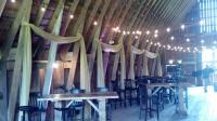 Custom Bistro Lighting set-up and fern green voile swag dress up this Barn for a Rustic Wedding Reception.